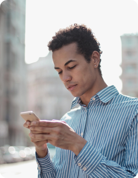 young man typing on smartphone