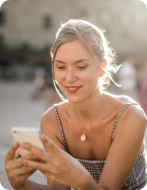 young woman typing on a smartphone